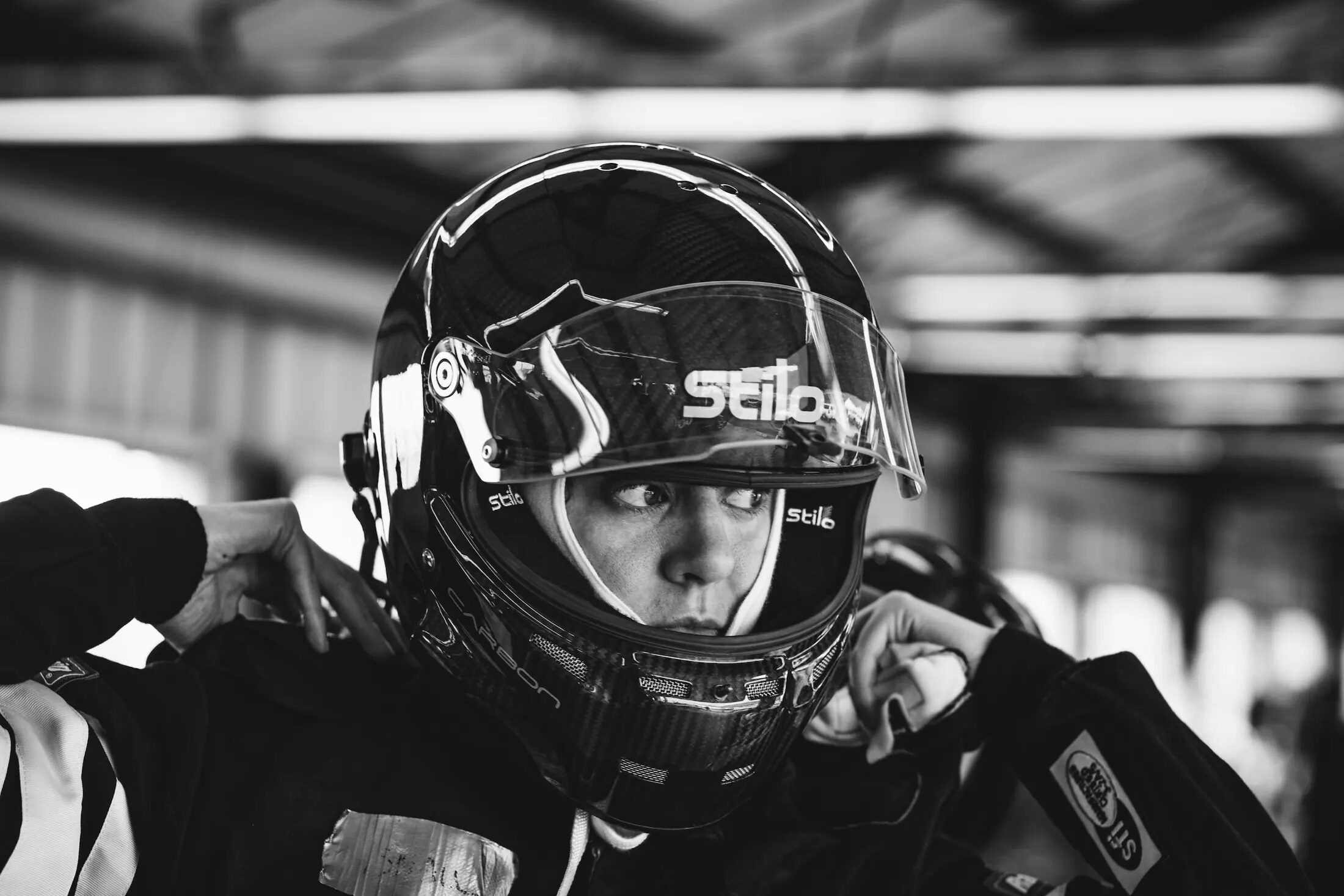 A motorsport portrait in natural light